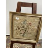 A 19th century silk tapestry depicting a bouquet of flowers, fitted within a gilt frame [height,
