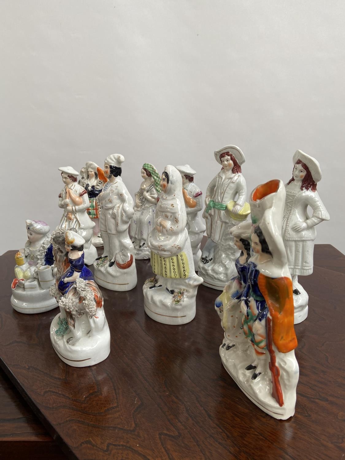 A Collection of antique Staffordshire figurines to include young girl sat upon a rams back, Asian - Image 9 of 9
