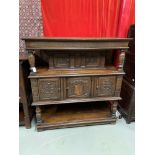 An Impressive 17th Century style oak court cupboard unit. Showing detailed carved panel doors and