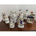 A Collection of antique Staffordshire figurines to include young girl sat upon a rams back, Asian