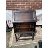 A dark oak writing bureau with barley twist supports [98 x 63 x 47cm]