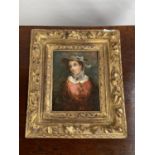 An 18th/ 19th century oil painting on wood, portrait of a lady, fitted within a moulded gilt