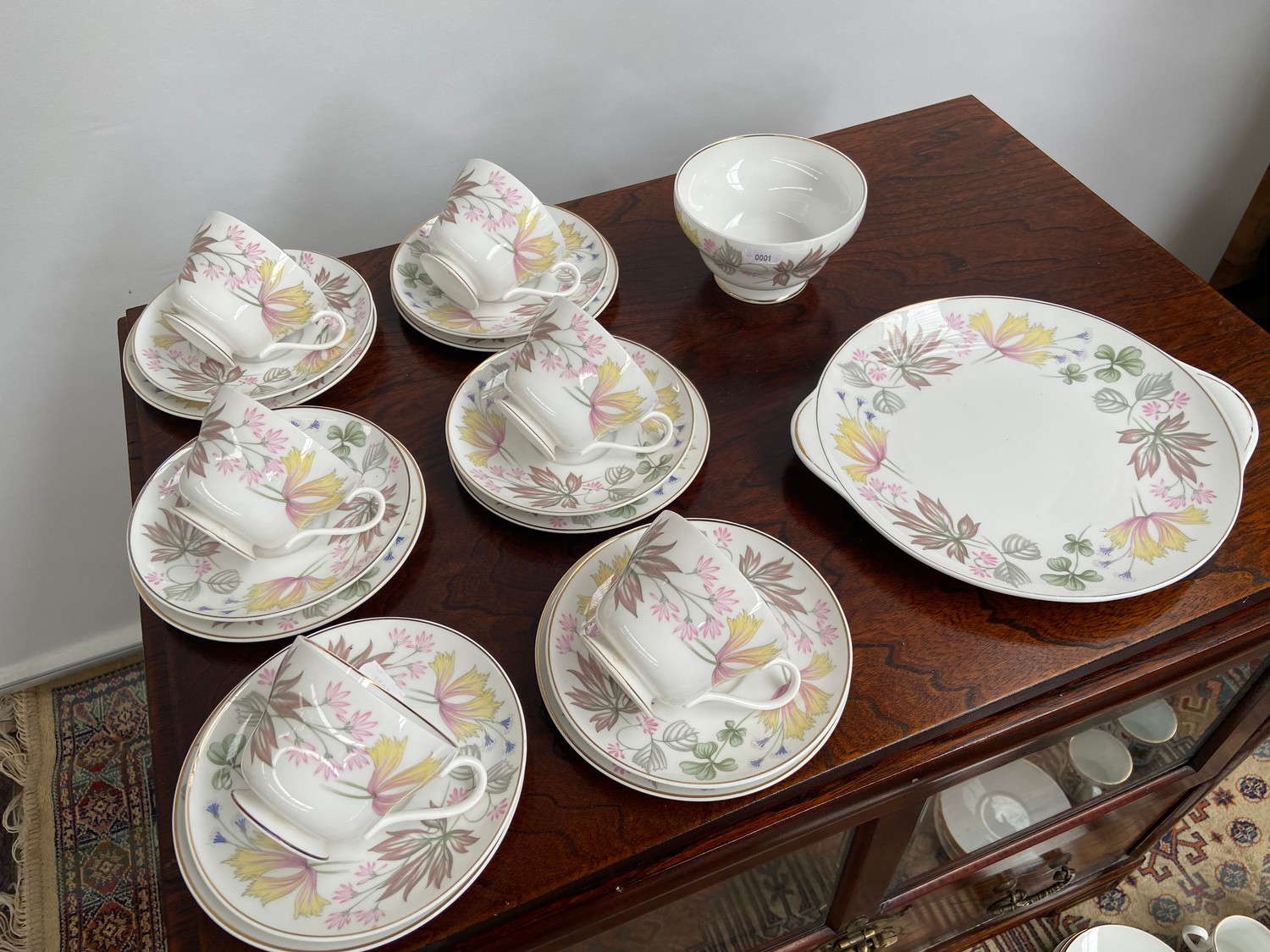 A 21 Piece vintage Shelley tea set titled 'Columbine' comes with cake plate, sugar and cream.