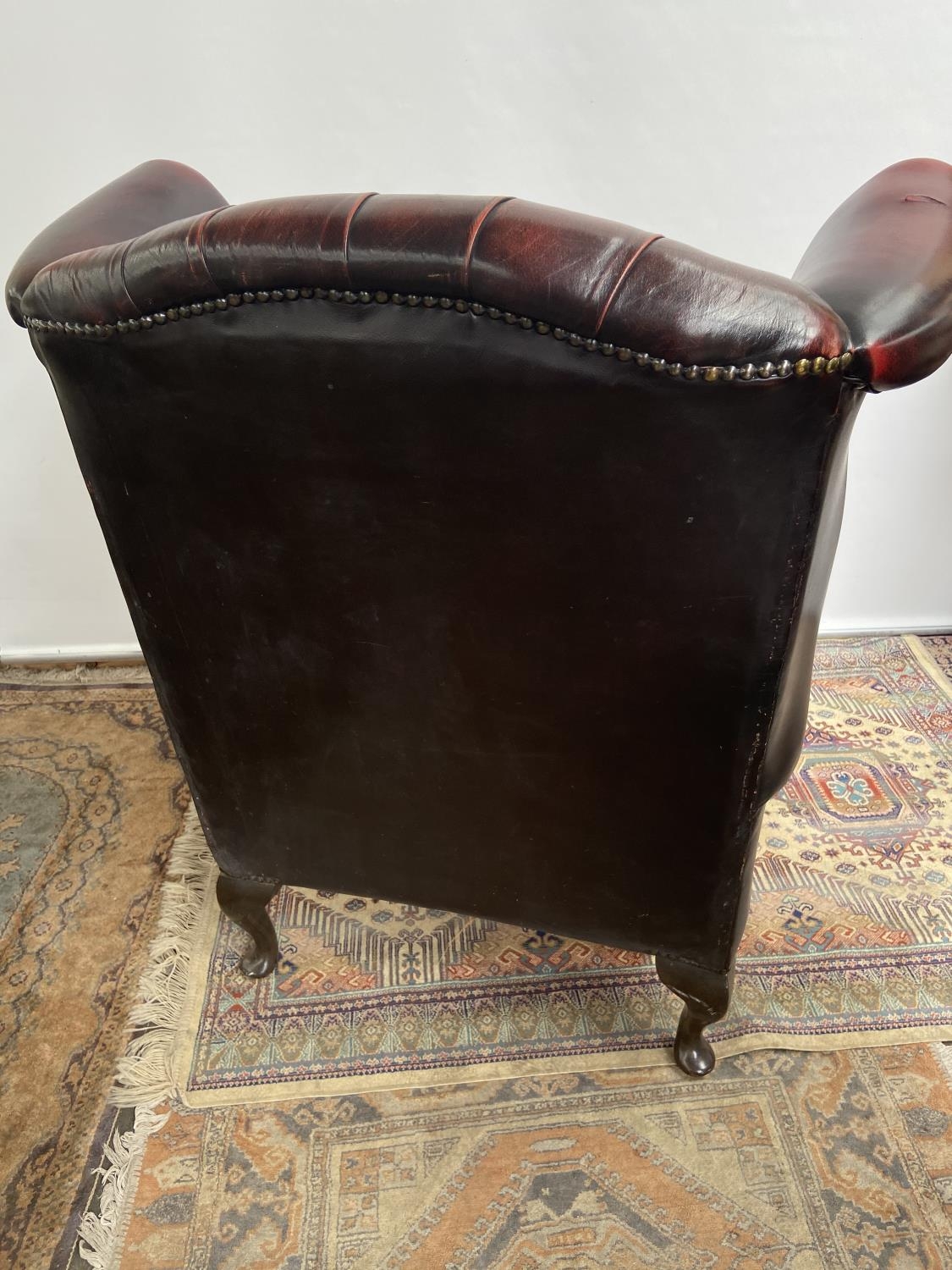 Antique chesterfield oxblood red gull wing arm chair. [107cm in height] - Image 7 of 7