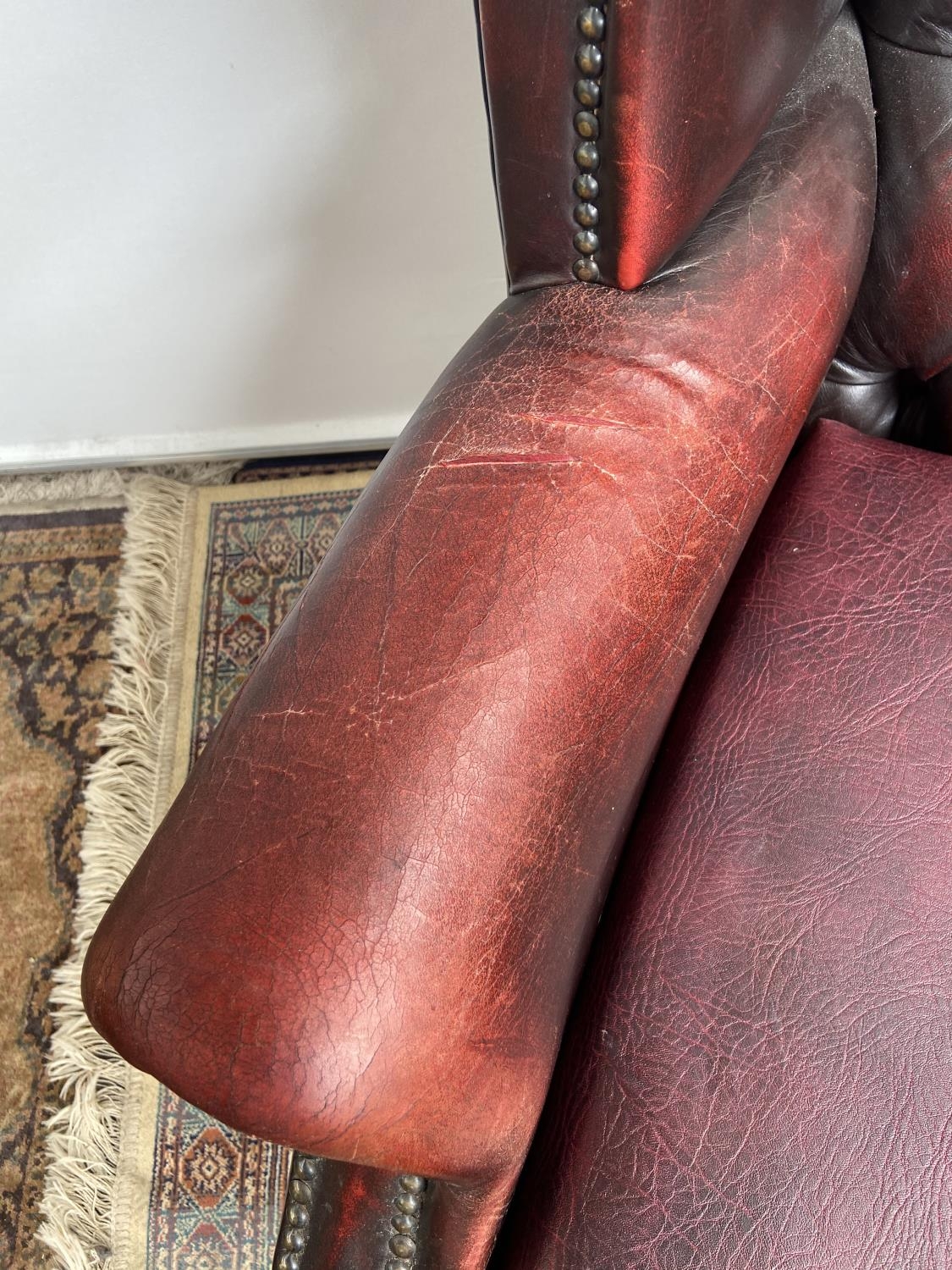 Antique chesterfield oxblood red gull wing arm chair. [107cm in height] - Image 3 of 7