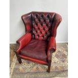 Antique chesterfield oxblood red gull wing arm chair. [95cm in height]