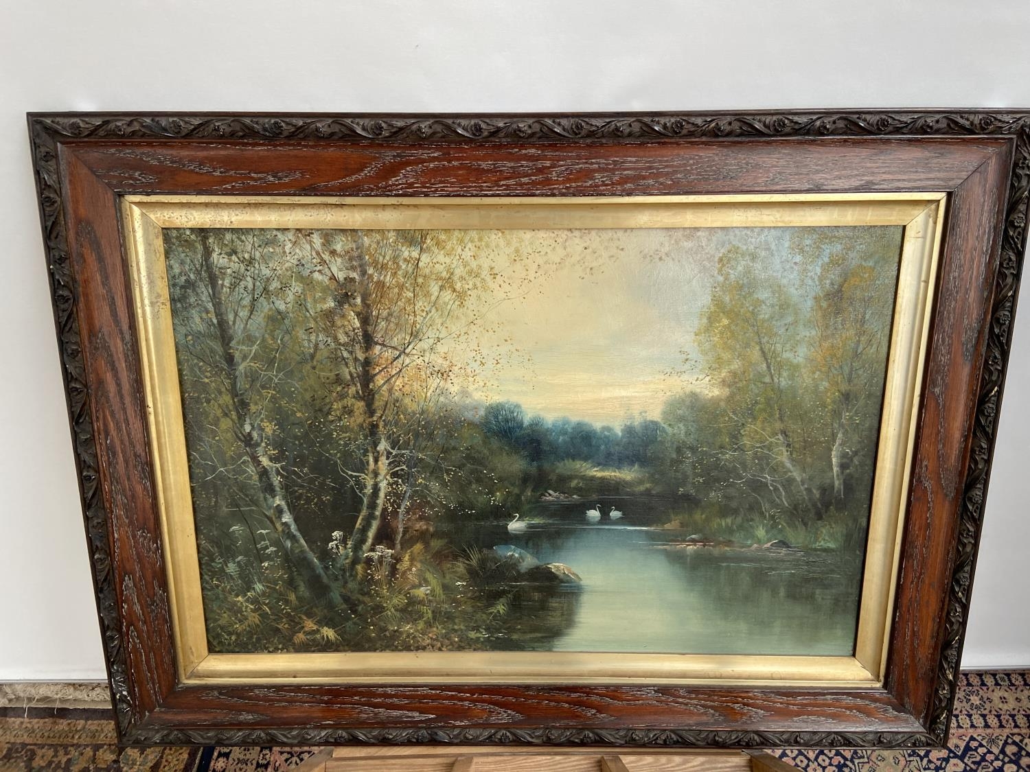 A 19th century oil painting on canvas depicting lake and forestry area. Signed by the artist [not