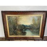 A 19th century oil painting on canvas depicting lake and forestry area. Signed by the artist [not