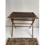 A 19th century folding writing desk. [Height 81cm] [82.5 x 60cm]