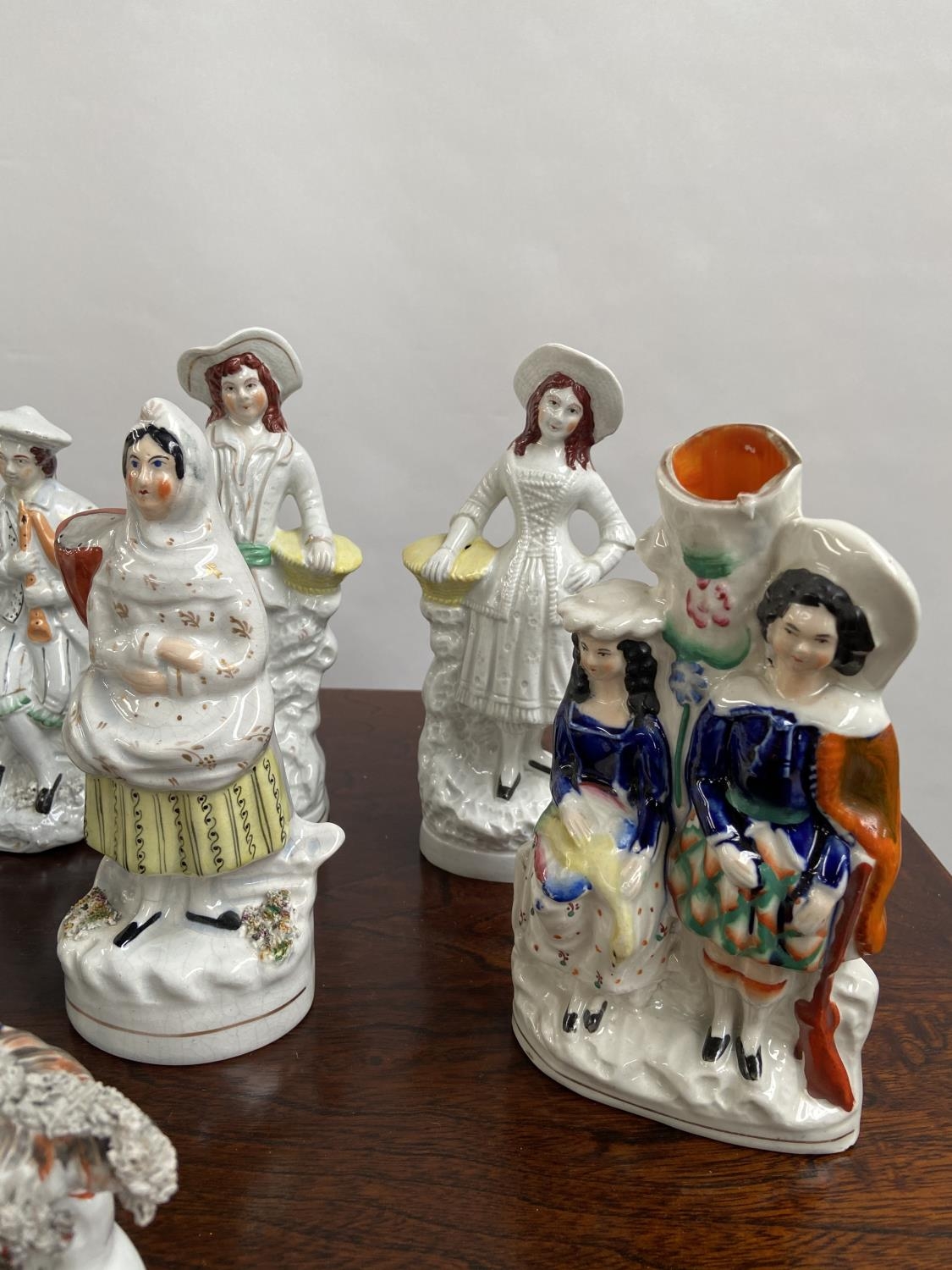 A Collection of antique Staffordshire figurines to include young girl sat upon a rams back, Asian - Image 2 of 9