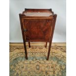 A Georgian side cabinet with single line inlay, raised on square straight legs, opening to the