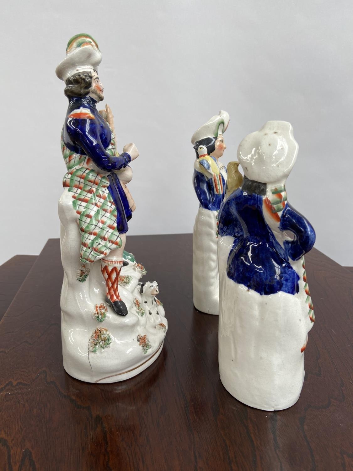 A Lot of three Antique Staffordshire Scottish design figurines. [29cm in height] - Image 4 of 6