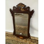 A Georgian bevel edged and giltwood trim wall mirror with a pierced and carved wood extension to the