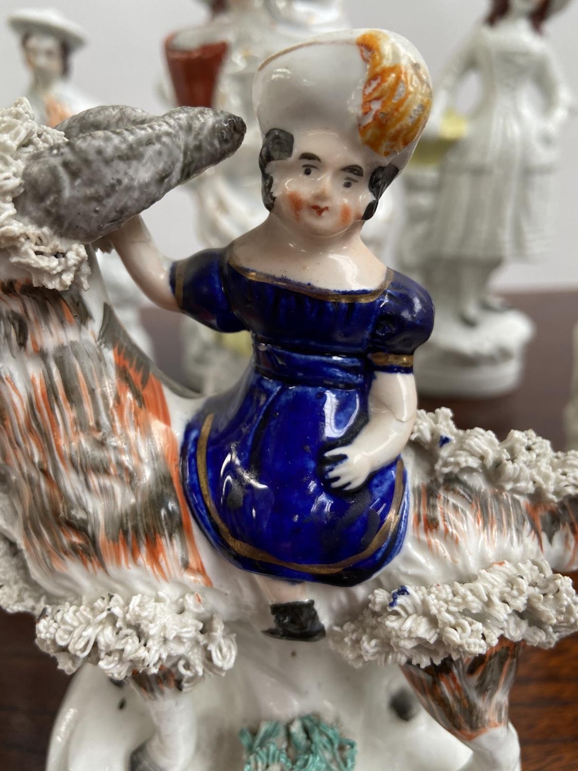 A Collection of antique Staffordshire figurines to include young girl sat upon a rams back, Asian - Image 5 of 9