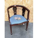 An Edwardian inlaid curved back arm chair, with three splat supports, upon pedestal legs,