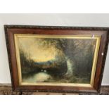 A 19th century oil painting on canvas depicting lake and forestry area scene. Fitted in a dark oak