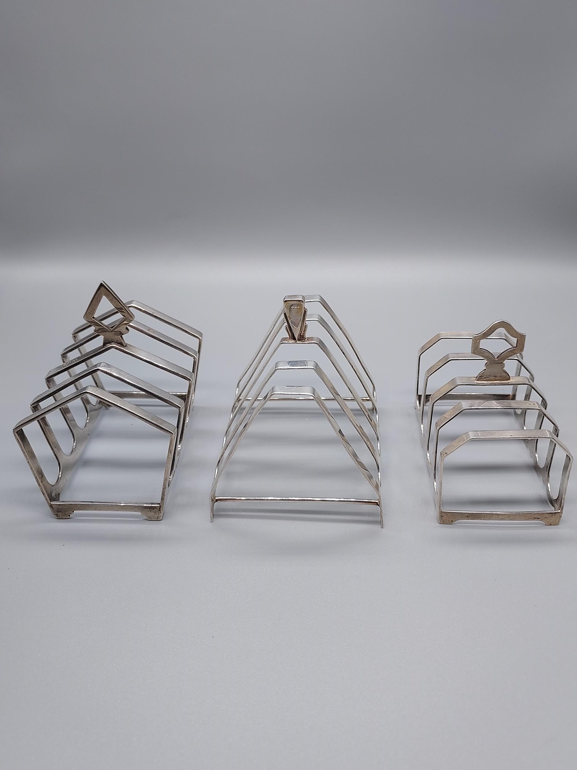 A Lot of three Birmingham silver four slice toast racks.