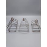 A Lot of three Birmingham silver four slice toast racks.