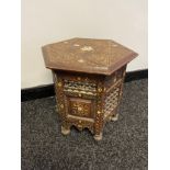An Antique Indian carved hexagonal side table, styled with mother of pearl inlays. [40x36x36cm]