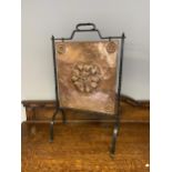 Antique wrought iron and copper firescreen designed with embossed English rose design. [80x47x26cm]