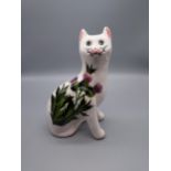 A Wemyss Ware G. Hill Pottery cat designed with a thistle. [17.5cm in height]
