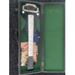 An Unusual Vintage small electric guitar with a fitted travel carry case.