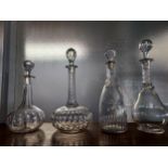 A Lot of four antique facet cut decanters. One in the shape of a pear. [Tallest 34cm]