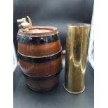 A WW1 Trench art artillery shell. Has a military insignia engraved to the front. Together with a