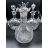 An Antique four section engraved decanter. Engraved Whisky, Gin, Brandy. Together with Two bulbous