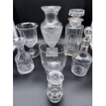 A Lot of vintage and Antique decanters and vases. Includes an gold trim and etched duck flying