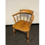 A 19th century elm wood smokers chair. Stamped to the back base. [78cm in height]