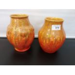 A Lot of two Pilkington Royal Lancastrian Orange drip glaze flame design vases. [17cm in height]