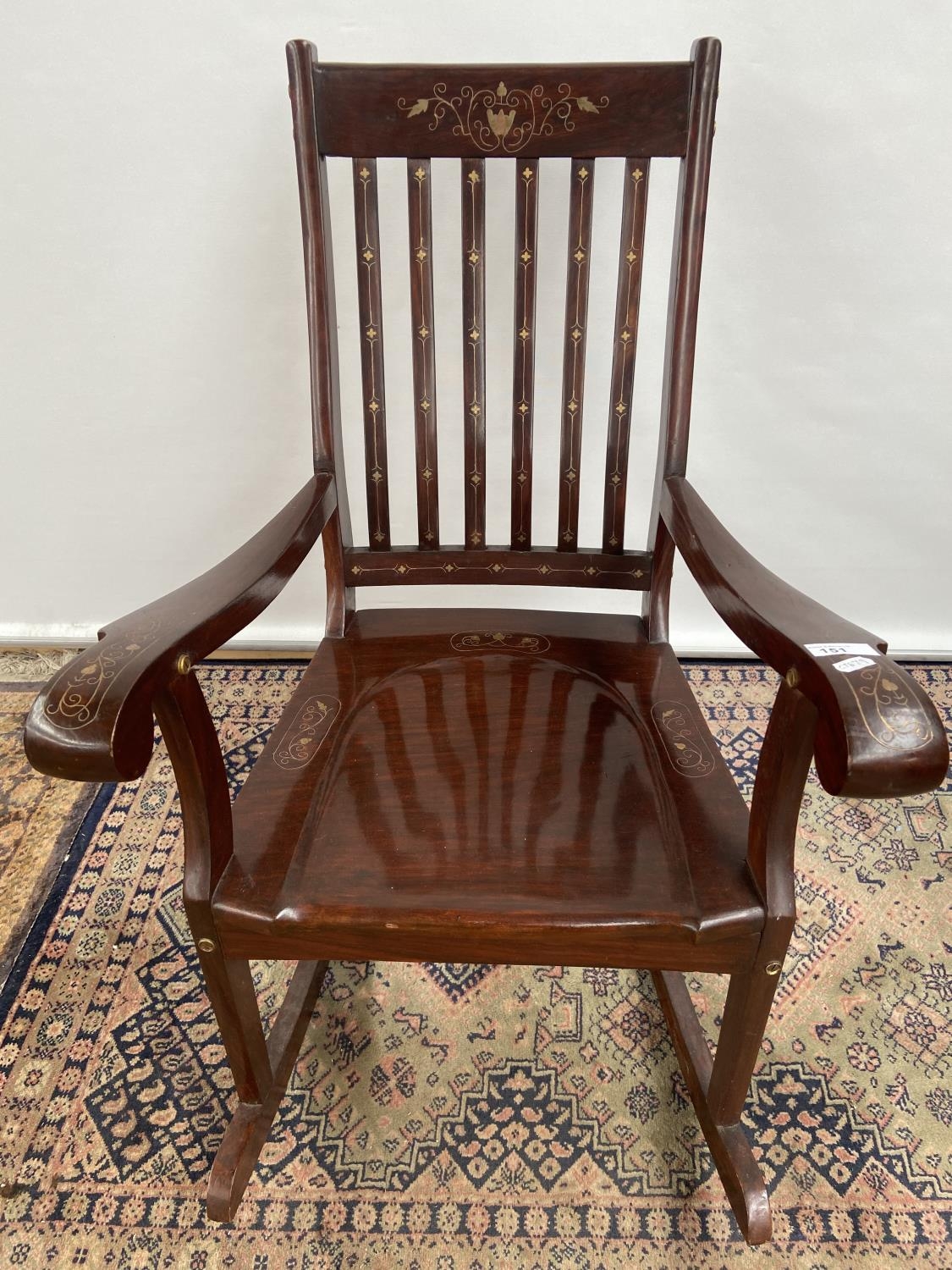 A Hardwood and brass inlaid rocking arm chair. [80x50x40cm] Originally from Saudi Arabia. - Image 3 of 3