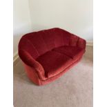 An Art Deco two seat sofa upholstered in a red material