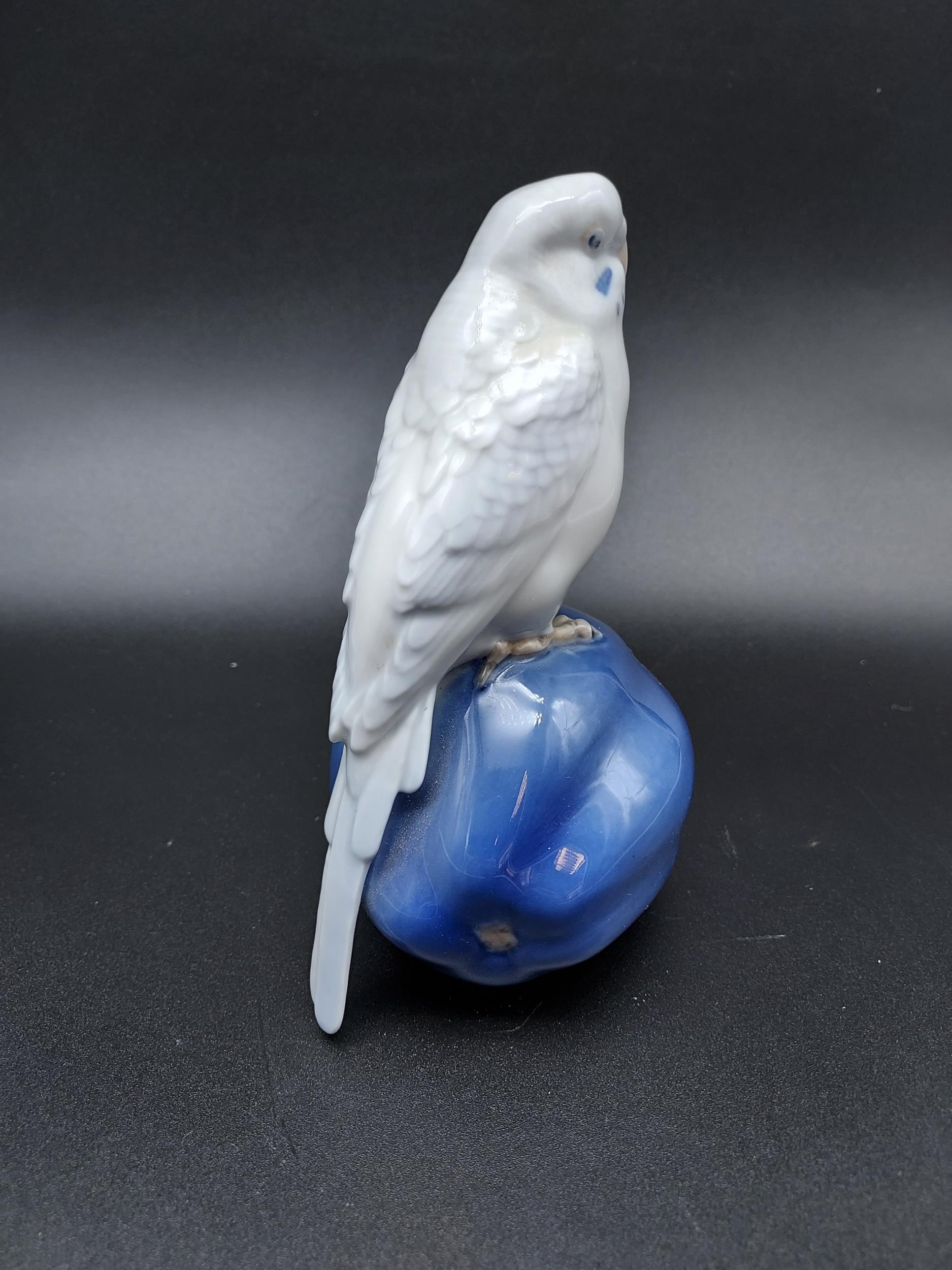A Royal Copenhagen figurine Budgie sat on a piece of fruit. [14cm in height] - Image 2 of 4