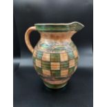 A Charlotte Rhead Burleigh ware checker design water jug. [22cm in height]