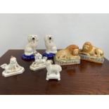 A Collection of antique Staffordshire animal figurines to include a pair of lions, Ram on a pedestal