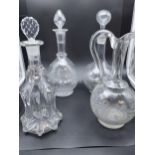 A Lot of four various antique facet and etched decanters and claret jug.