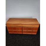 A Mid century teak McIntosh of Kirkcaldy two drawer, two door sideboard. Missing lip to back. [