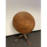 A 18th century George III mahogany tripod tea table. Tilt on a spiral carved baluster column with