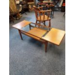 A Mid century teak and glass stylish coffee table. Produced by G-Plan. [43x137x51cm]