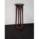 An Arts & Crafts style torcher/ plant stand. [105cm in height]