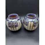 A pair of Royal Doulton Lambeth floral design bulbous vases. [17cm in height]