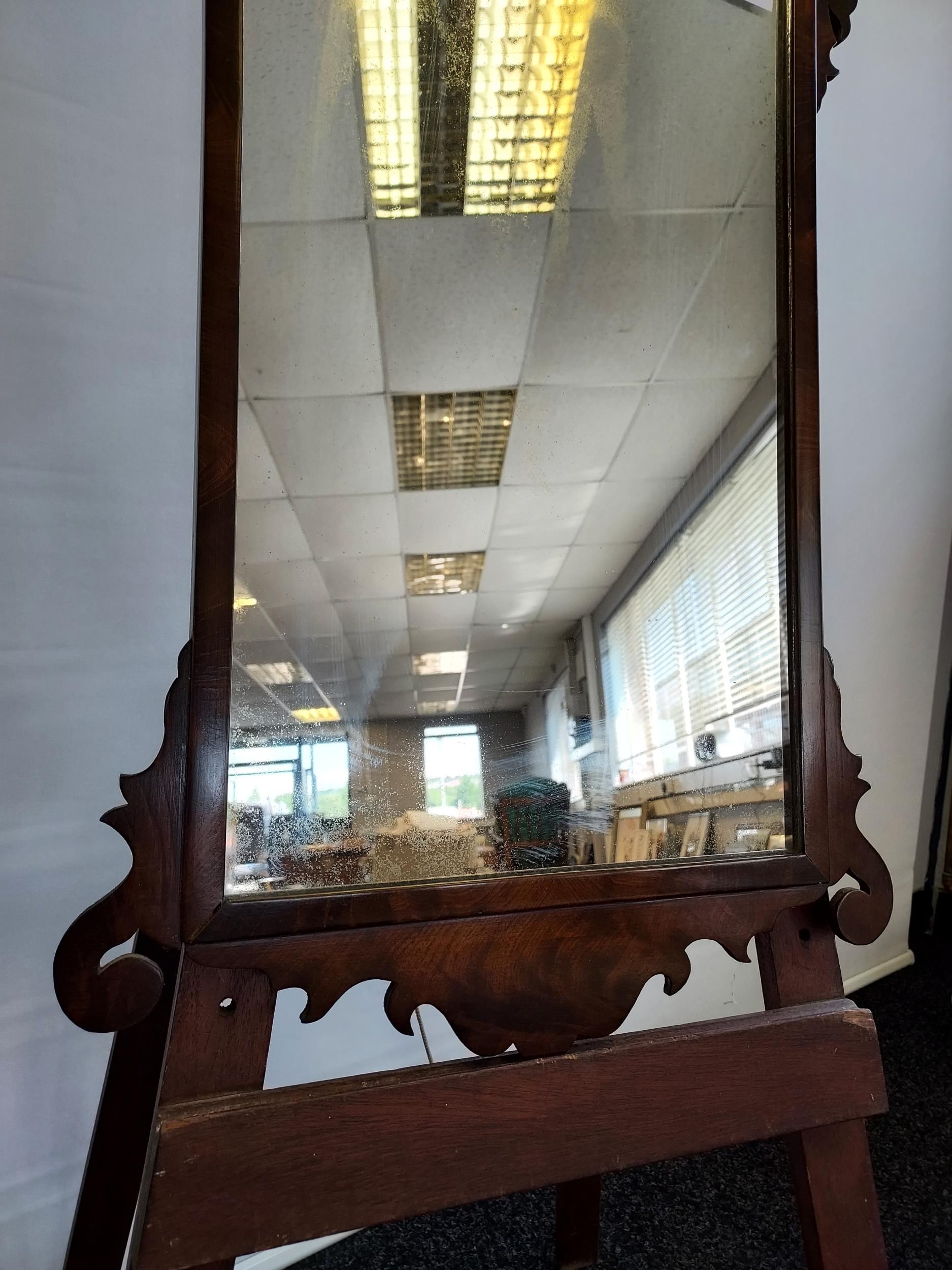 A Georgian mahogany framed mirror. In a Chippendale style, shaped crested top top and bottom [80cm - Image 2 of 3