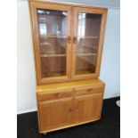 An Ercol light elm wood display cabinet [162x90x45cm]