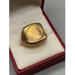 A Gent's 9ct gold ring set with a 1945 Mexican 2 Pesos Gold Coin. [Ring size T] [7.00grams]