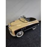 A Vintage Buick Torpedo pedal car.