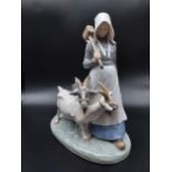A Royal Copenhagen figurine girl with goats. [23cm in height]