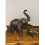 An antique large Liberty & Co London Omersa leather elephant footstool and one smaller. [72cm in