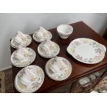 A 21 Piece vintage Shelley tea set titled 'Columbine' comes with cake plate, sugar and cream.